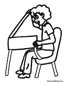 Boy at His School Desk